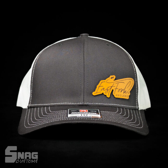 custom laser engraved leather patch on richardson 112 115 yupoong hat. hermann oak leather. laser engraved in montana, usa