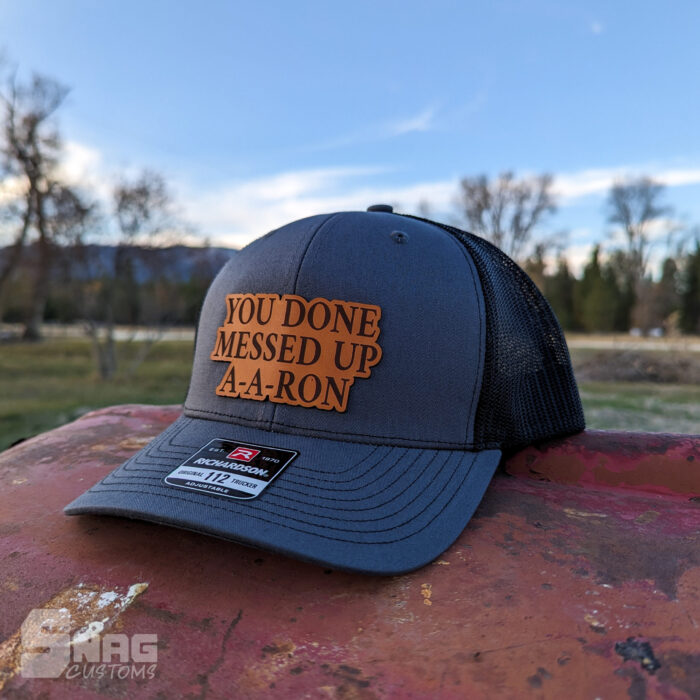 custom laser engraved leather patch on richardson 112 115 yupoong hat. hermann oak leather. laser engraved in montana, usa