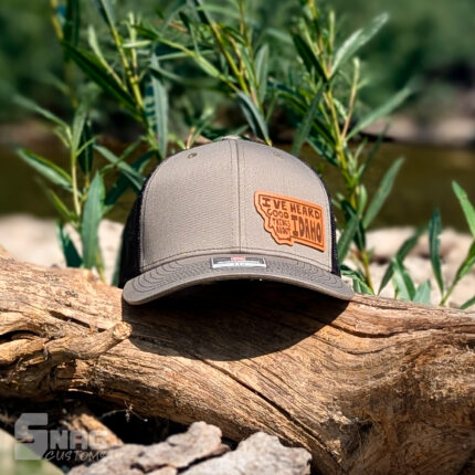 Montana outline with "I've heard good things about idaho" leather patch hat
